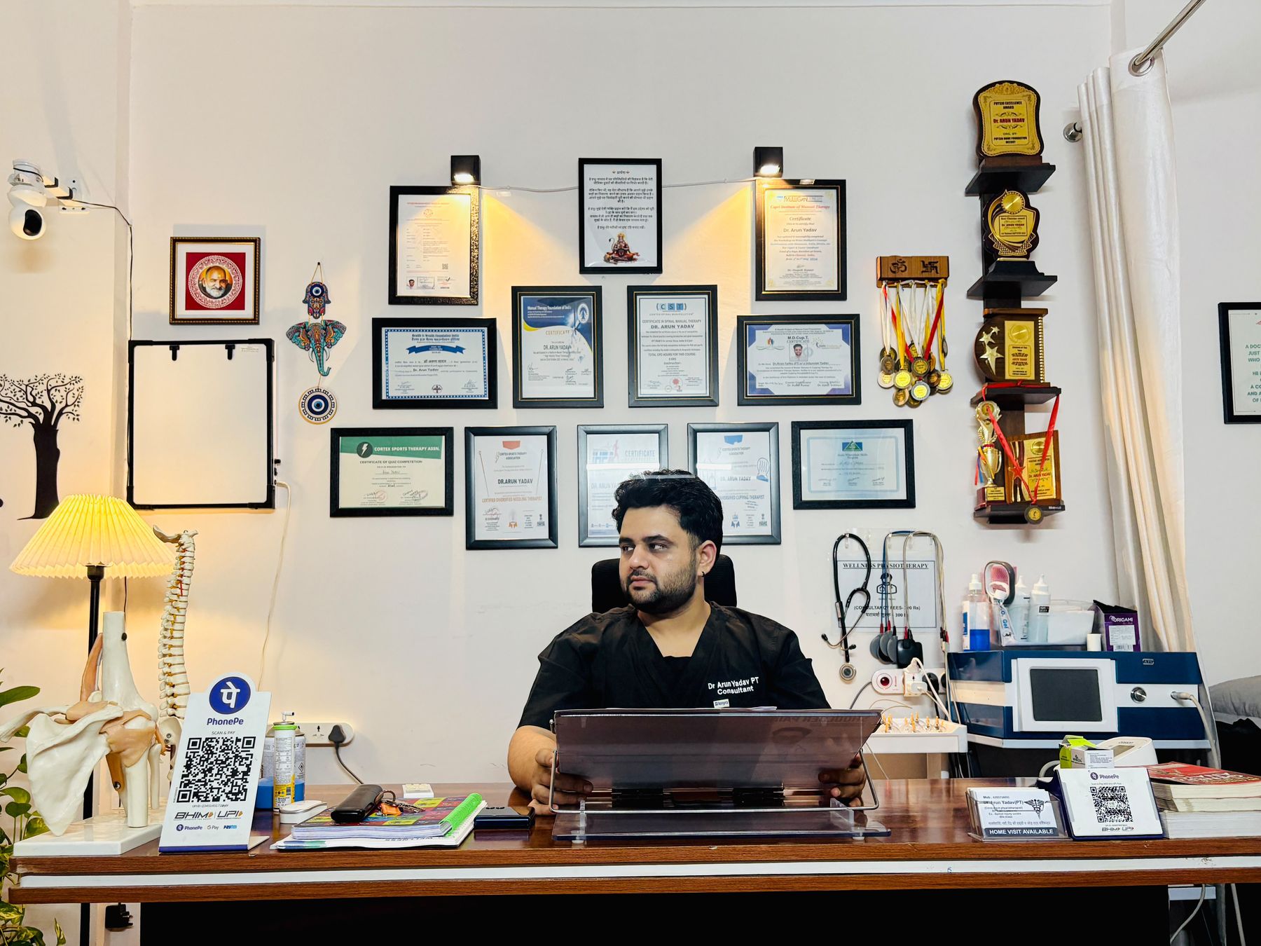 Dr. Arun Yadav at the clinic desk